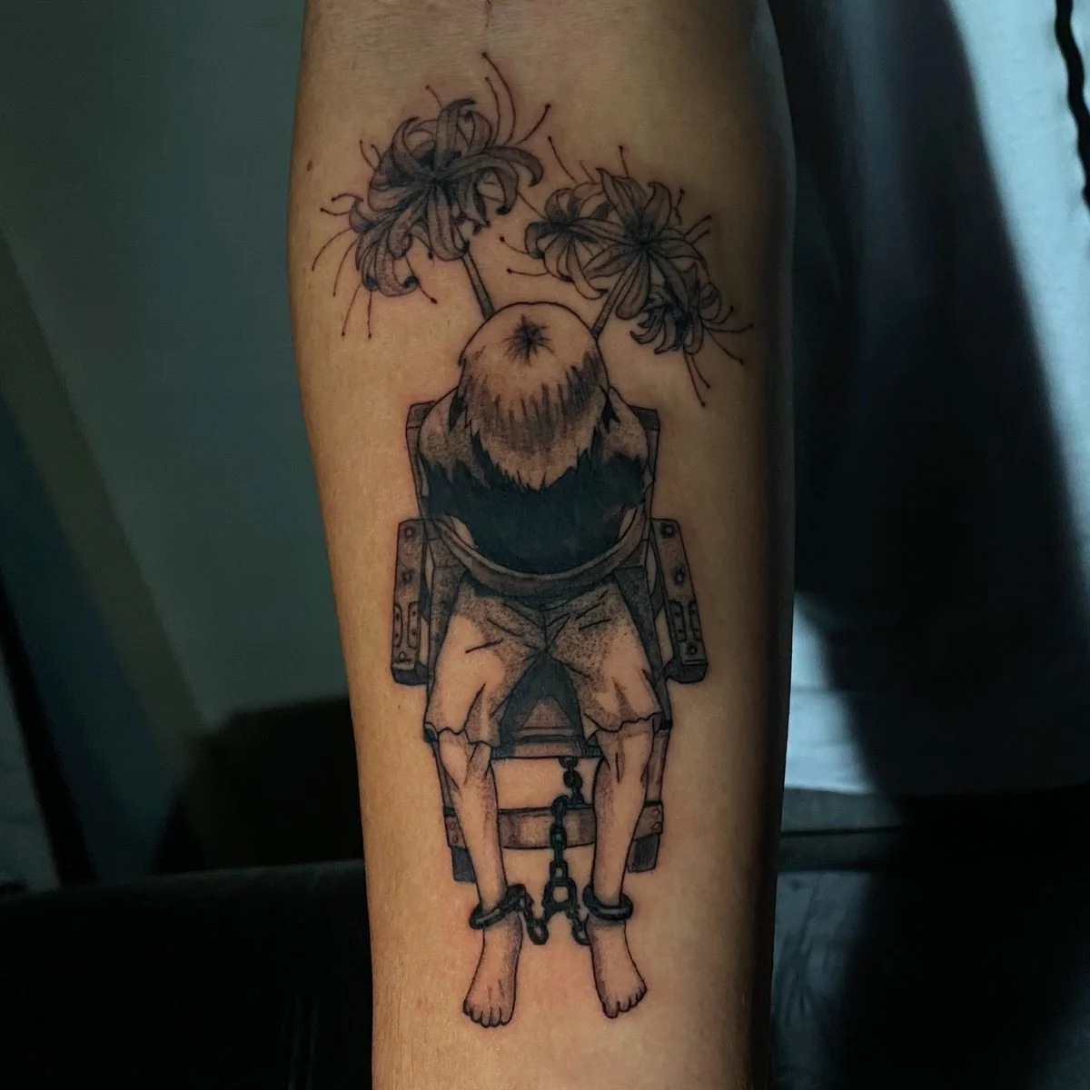 Tattoo personagem sentado